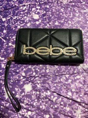 bebe Black Quilted Wristlet with Gold Crystal Logo Emblem